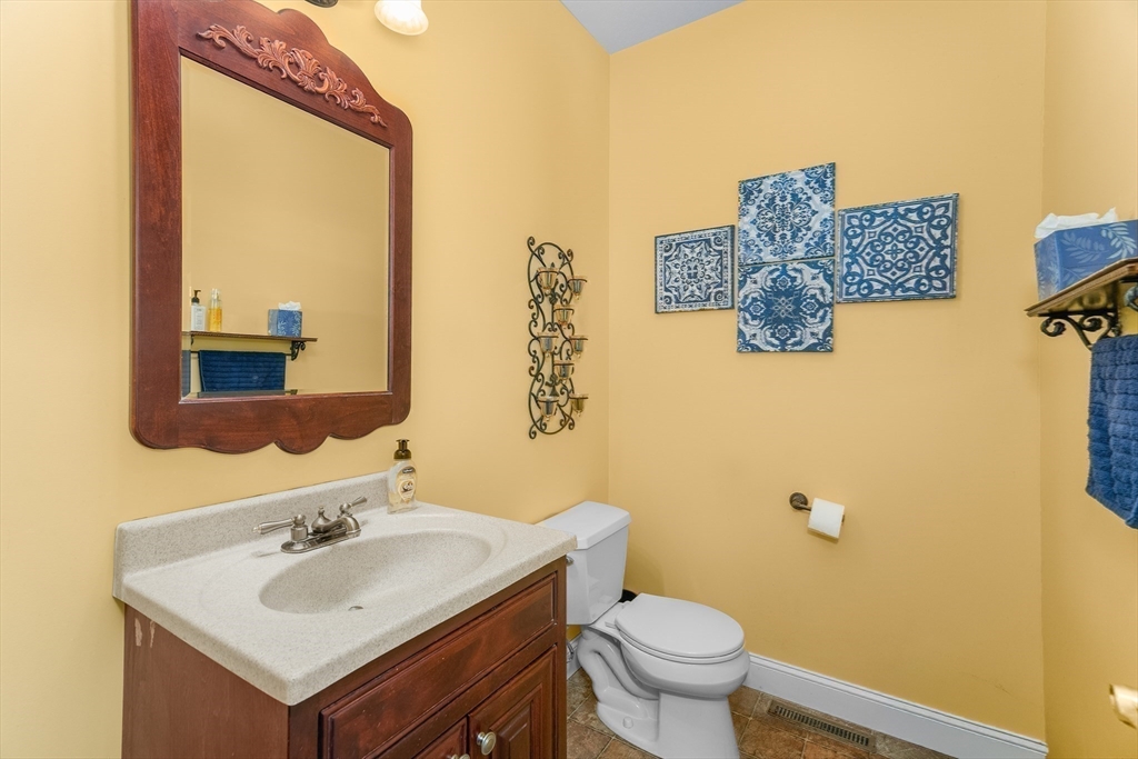 113 Greenwich Plains Road Ware, MA 01082 - Photo 15 of 42 a bathroom with a sink mirror and toilet