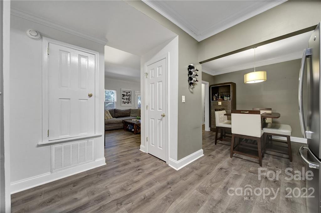 1012 Queens Road, Unit C Charlotte, NC 28207 - Photo 11 of 30 a view of a hallway and dining room with wooden floor