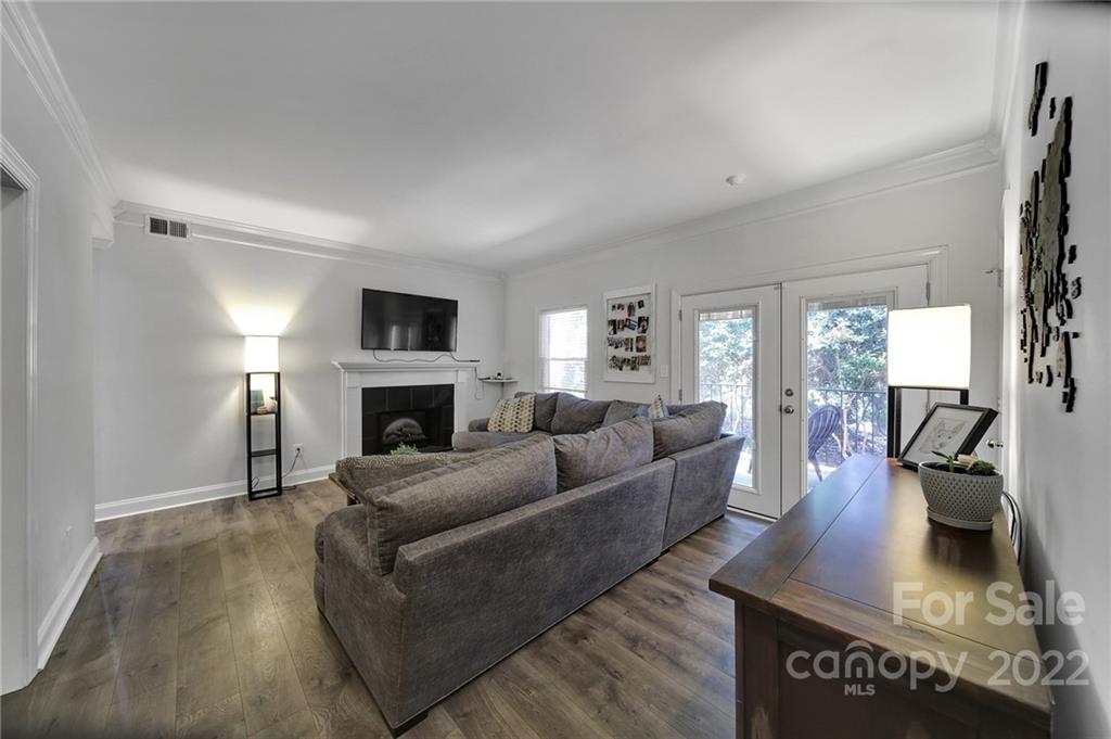 1012 Queens Road, Unit C Charlotte, NC 28207 - Photo 2 of 30 a living room with furniture and a fireplace