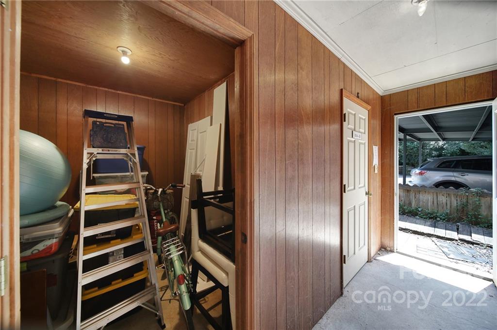 1012 Queens Road, Unit C Charlotte, NC 28207 - Photo 25 of 30 a view of walk in closet with clothes and shoes