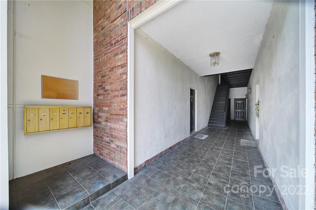 1012 Queens Road, Unit C Charlotte, NC 28207 - Photo 26 of 30 a view of a hallway to an empty room with a fireplace