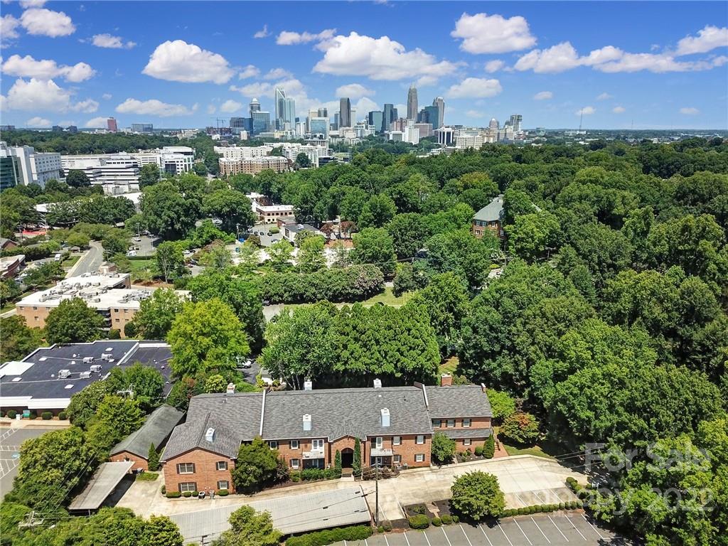 1012 Queens Road, Unit C Charlotte, NC 28207 - Photo 27 of 30 an aerial view of a house with a yard and lake view