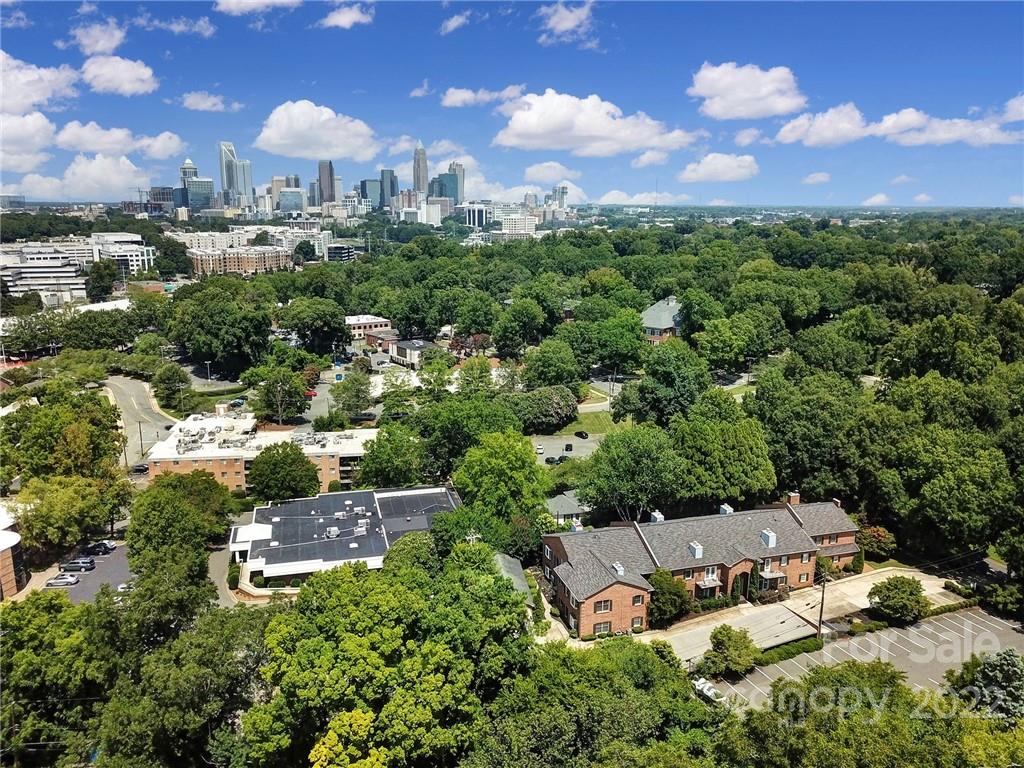 1012 Queens Road, Unit C Charlotte, NC 28207 - Photo 28 of 30 an aerial view of a house with a yard and lake view