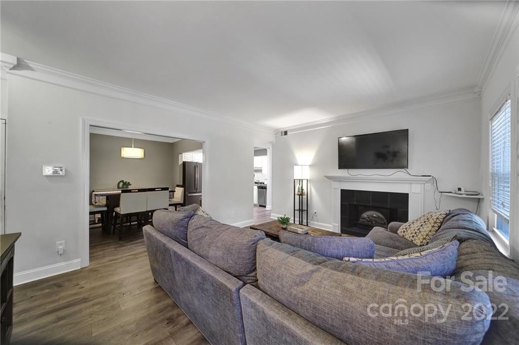 1012 Queens Road, Unit C Charlotte, NC 28207 - Photo 4 of 30 a living room with furniture and a fireplace