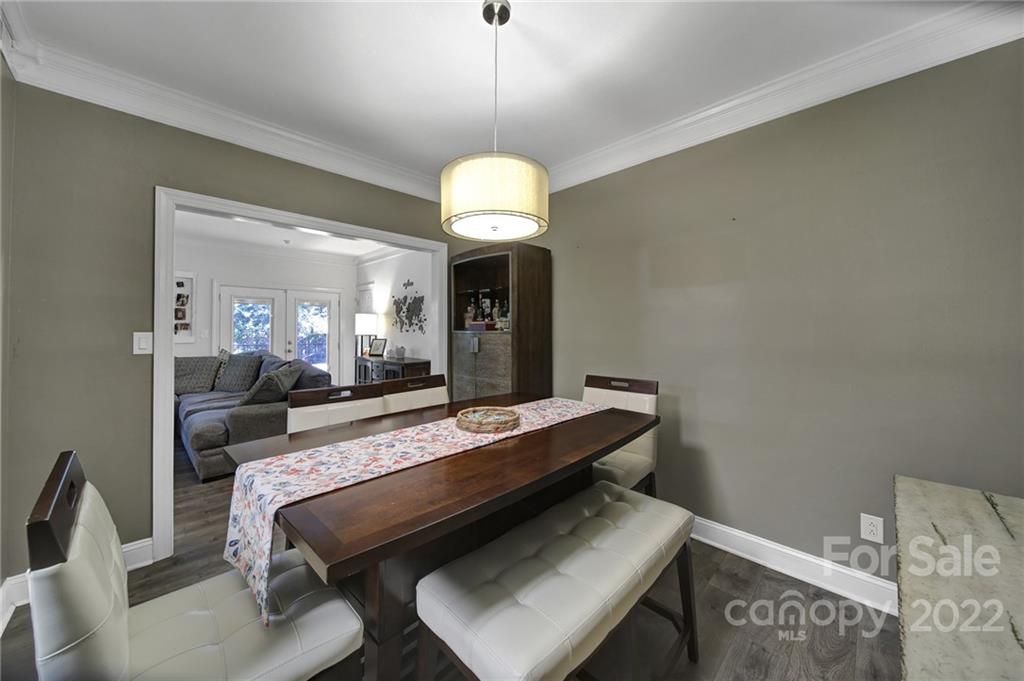1012 Queens Road, Unit C Charlotte, NC 28207 - Photo 5 of 30 a room with chandelier furniture and a chandelier