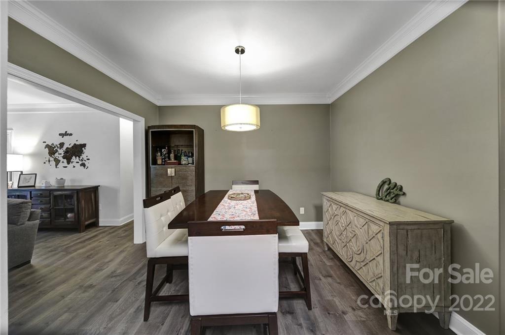 1012 Queens Road, Unit C Charlotte, NC 28207 - Photo 6 of 30 a dining room with furniture and wooden floor