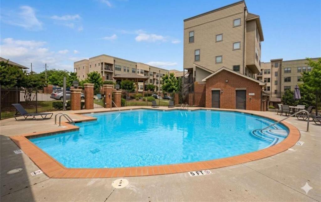 898 Oak Street Southwest, Unit 1418 Atlanta, GA 30310 - Photo 22 of 22 a view of a swimming pool with outdoor seating