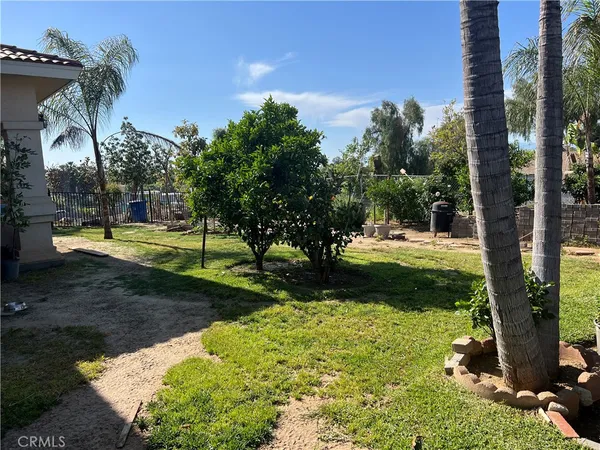 a view of backyard of a house