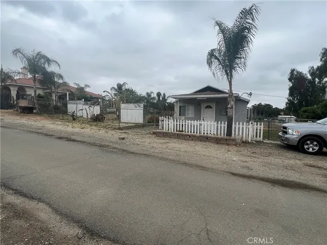 a house with trees in the background