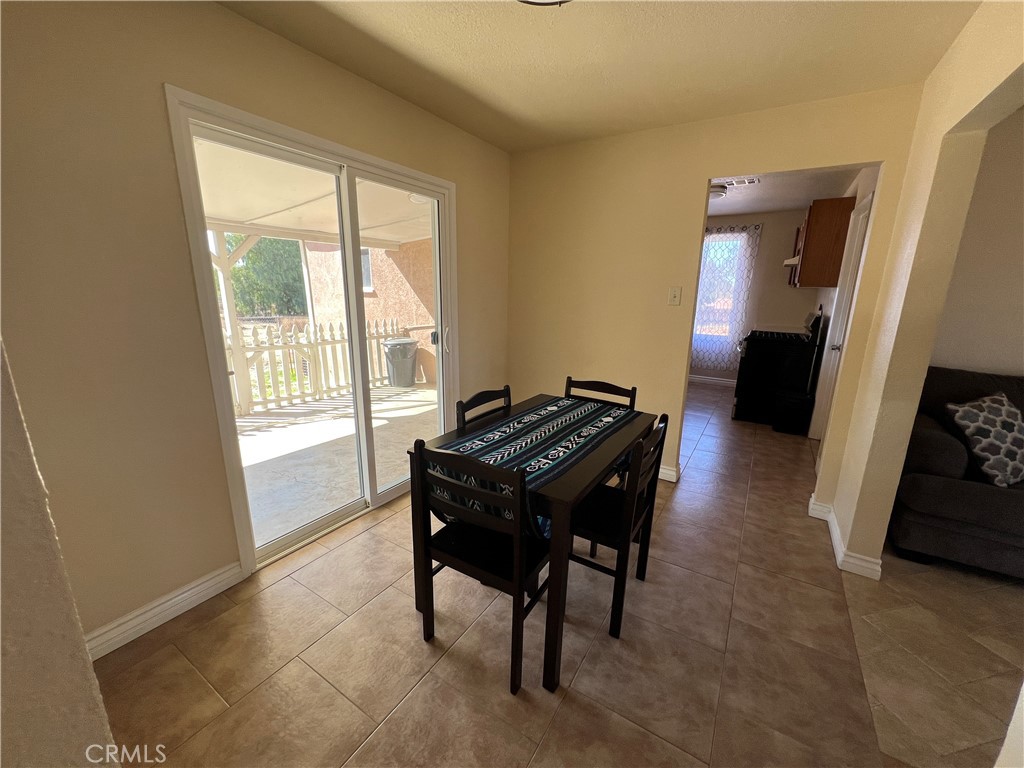17305 Sage Avenue Riverside, CA 92504 - Photo 36 of 40 a living room with a table and a window