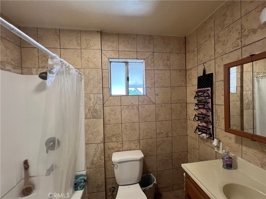 17305 Sage Avenue Riverside, CA 92504 - Photo 39 of 40 a bathroom with a sink toilet and shower