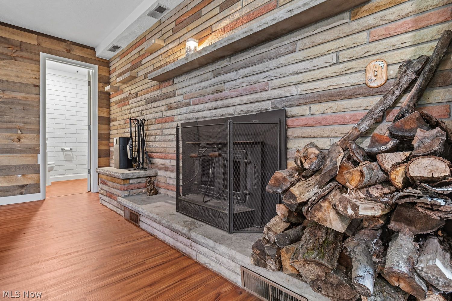 6885 Kepler Road Clinton, OH 44216 - Photo 23 of 38 Wood burning fireplace, half bath