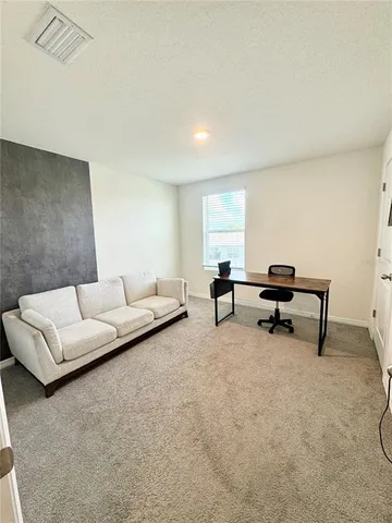 a living room with furniture and a couch
