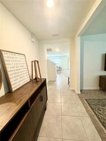 a spacious bathroom with a granite countertop sink and a mirror