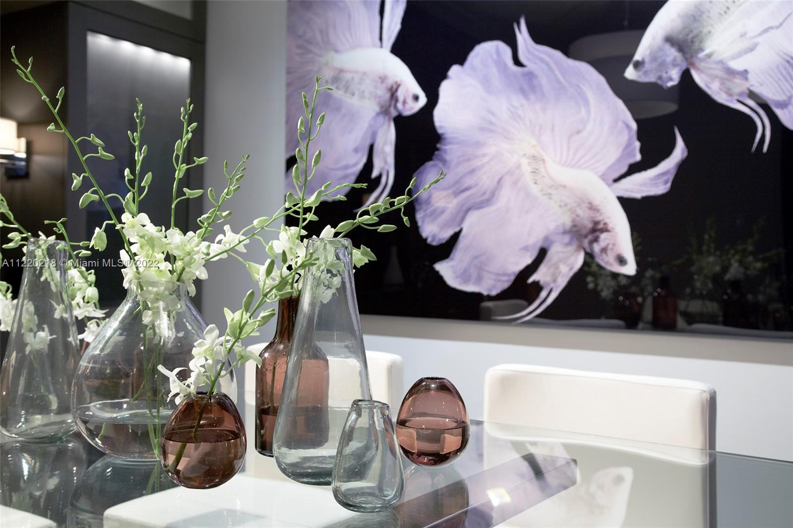 200 Biscayne Blvd Way, Unit 5211 Miami, FL 33131 - Photo 6 of 11 a vase of flowers sitting on a table