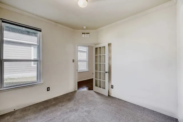 a view of empty room with windows