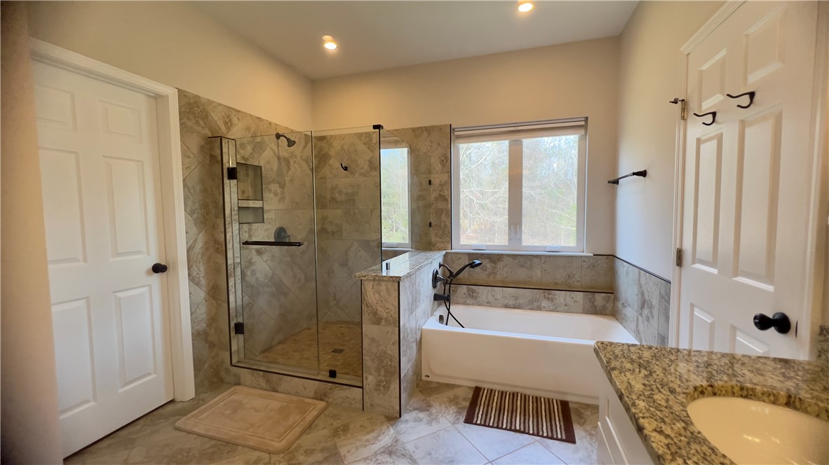 160 Hudgins Lake Road Townville, SC 29689 - Photo 23 of 41 Indulge in a generously proportioned bath featuring a separate walk-in shower and ample vanity space.