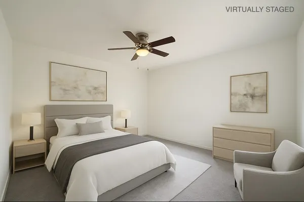 a bedroom with a bed and couch