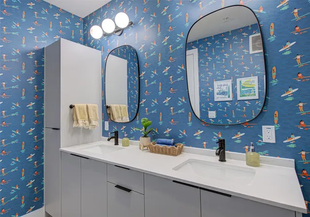 a bathroom with a sink and a mirror