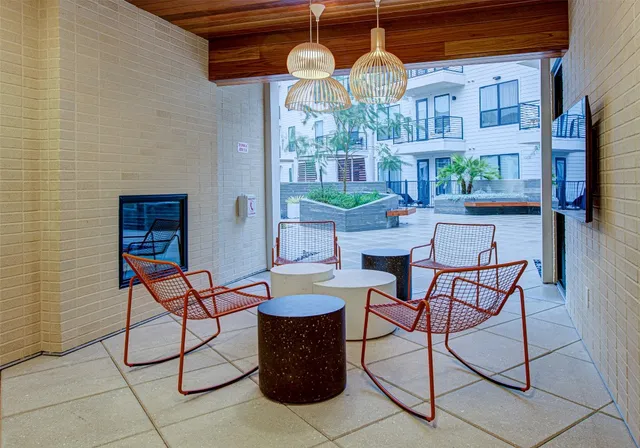 a outdoor space with tables and chairs