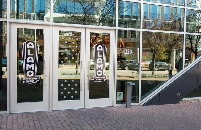 a view of a patio with a table and chairs