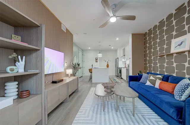 a living room with furniture and a rug