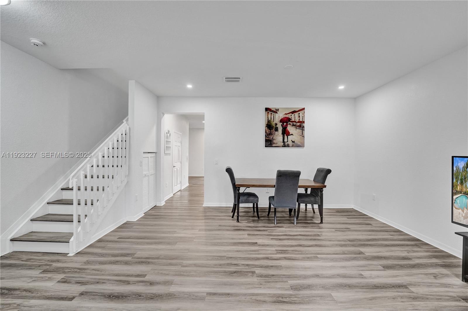 8993 Southwest 17th Court Miramar, FL 33025 - Photo 11 of 41 a view of a dining room with furniture and wooden floor