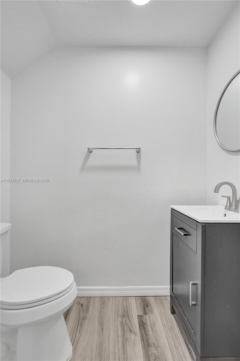 8993 Southwest 17th Court Miramar, FL 33025 - Photo 15 of 41 a bathroom with a sink a toilet and vanity