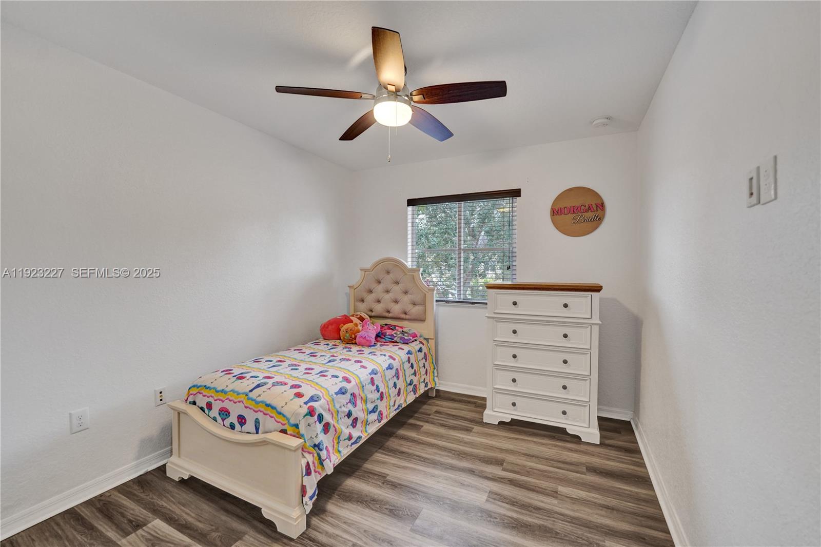 8993 Southwest 17th Court Miramar, FL 33025 - Photo 17 of 41 a bedroom with a bed and a window