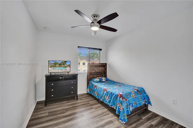 a bedroom with a bed and furniture