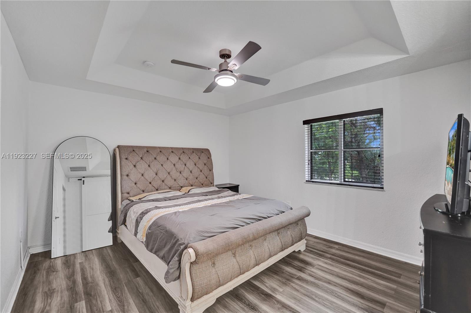 8993 Southwest 17th Court Miramar, FL 33025 - Photo 25 of 41 a bedroom with a bed and a window