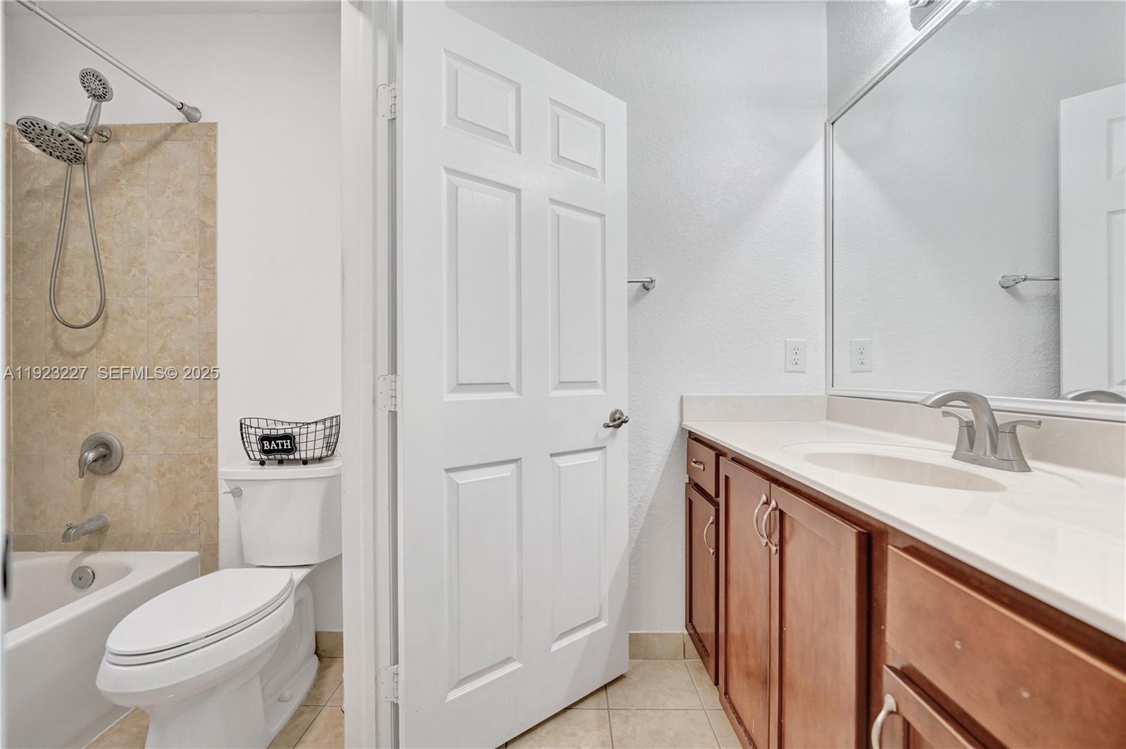 8993 Southwest 17th Court Miramar, FL 33025 - Photo 26 of 41 a bathroom with a granite countertop sink toilet and shower