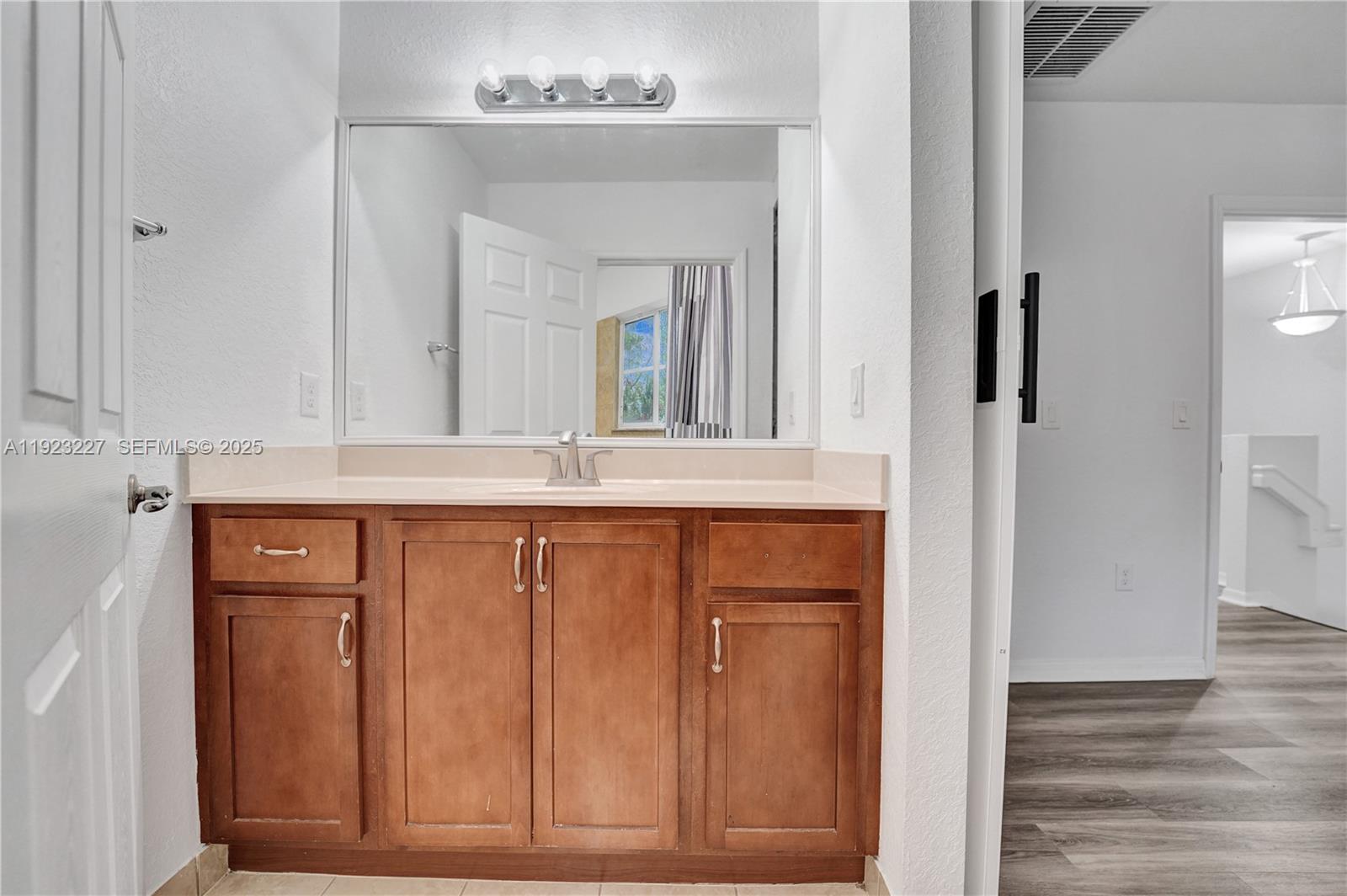 8993 Southwest 17th Court Miramar, FL 33025 - Photo 28 of 41 wooden floor with a mirror