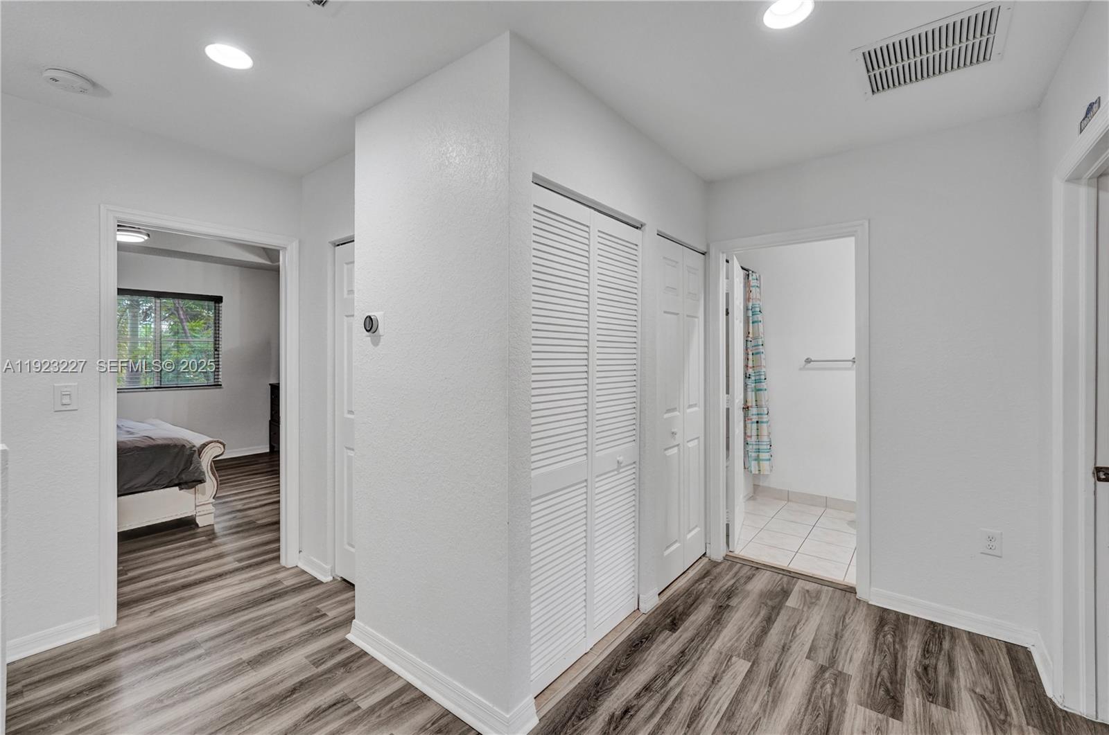 8993 Southwest 17th Court Miramar, FL 33025 - Photo 29 of 41 a view of a room with wooden floor and a bathroom