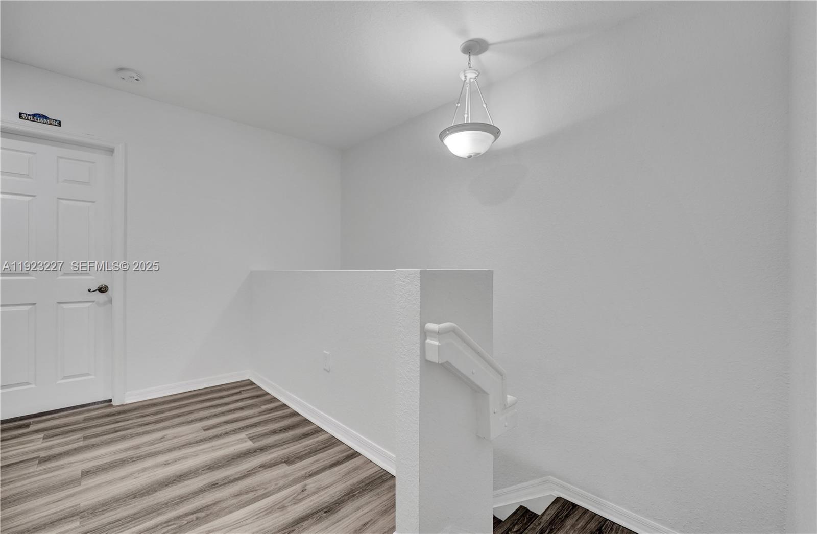 8993 Southwest 17th Court Miramar, FL 33025 - Photo 30 of 41 a view of a room with wooden floor and fan