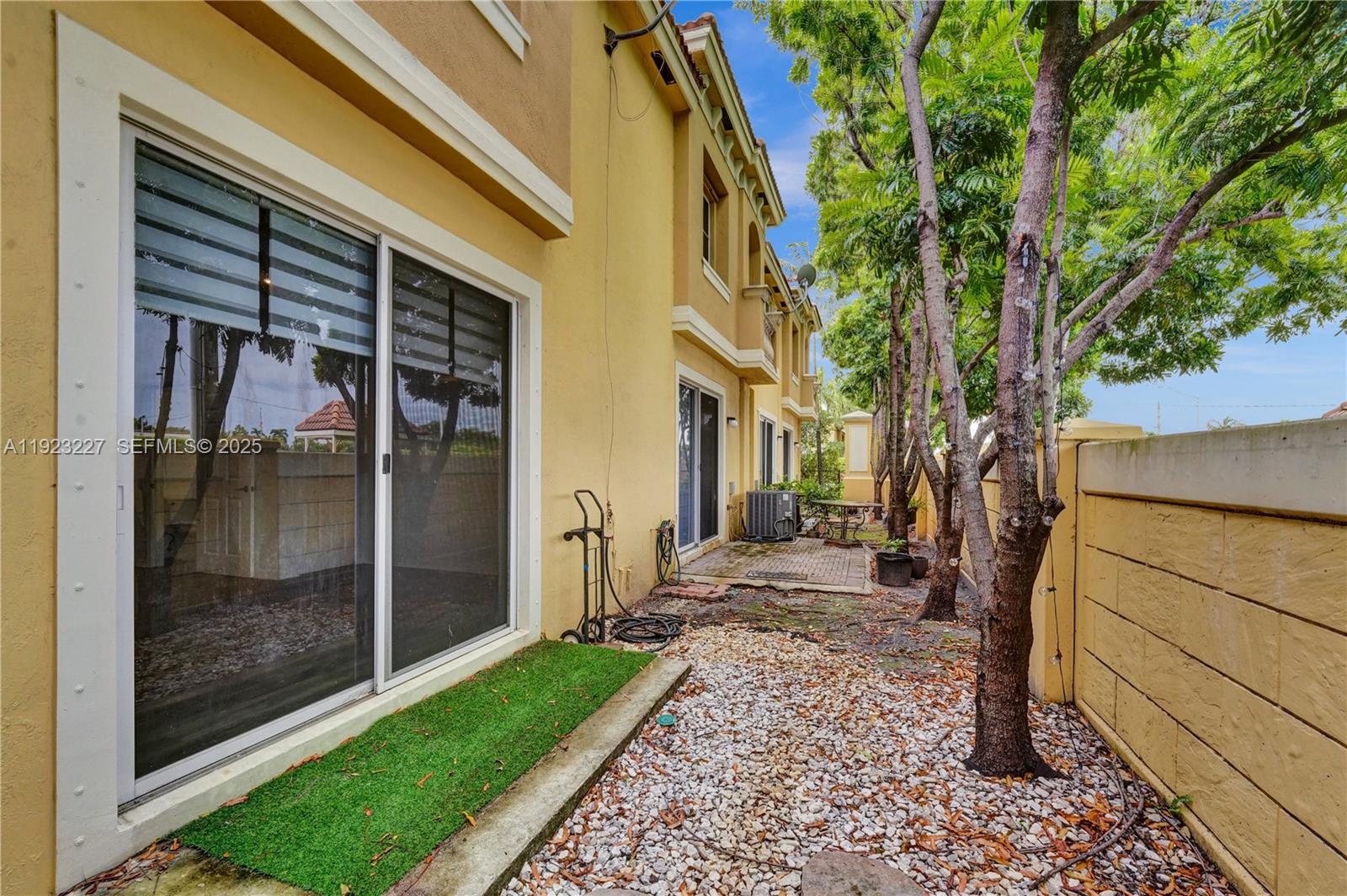8993 Southwest 17th Court Miramar, FL 33025 - Photo 34 of 41 a view of a porch with a tree