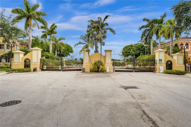 a view of a street with palm trees