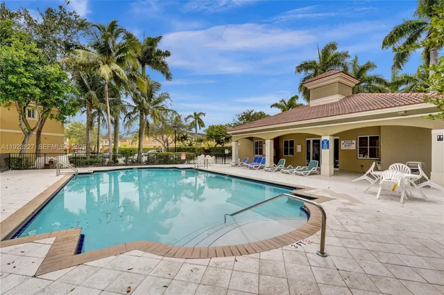 a view of a house with swimming pool