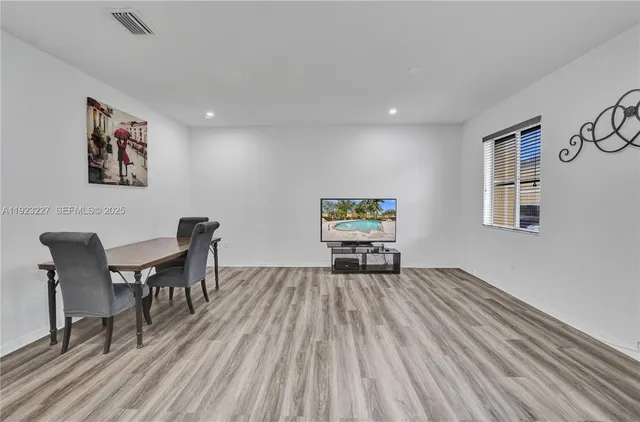 a workspace with furniture window and wooden floor