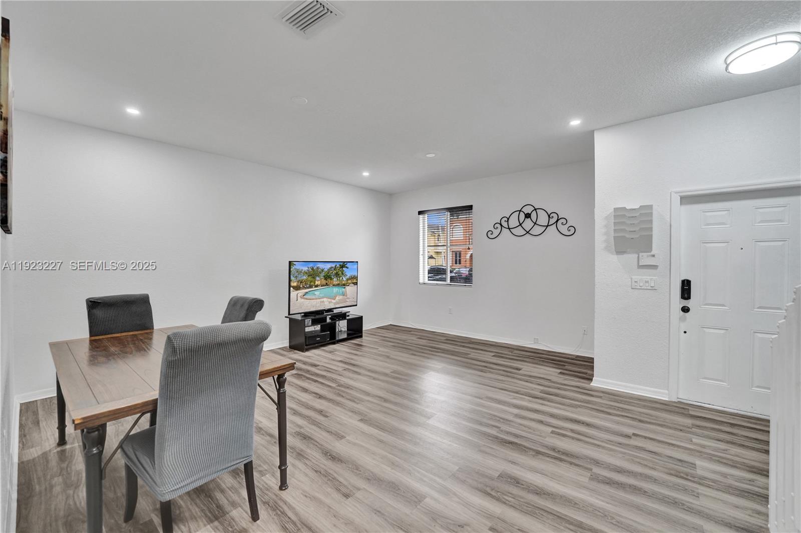 8993 Southwest 17th Court Miramar, FL 33025 - Photo 9 of 41 a view of a livingroom with furniture and wooden floor