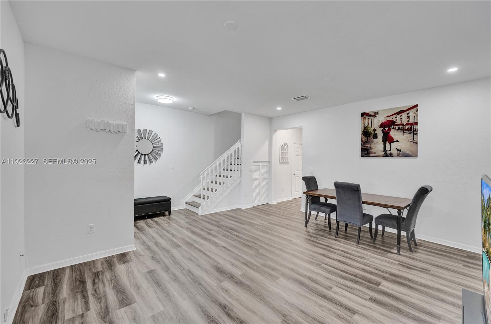 8993 Southwest 17th Court Miramar, FL 33025 - Photo 10 of 41 a view of a dining room with furniture and wooden floor