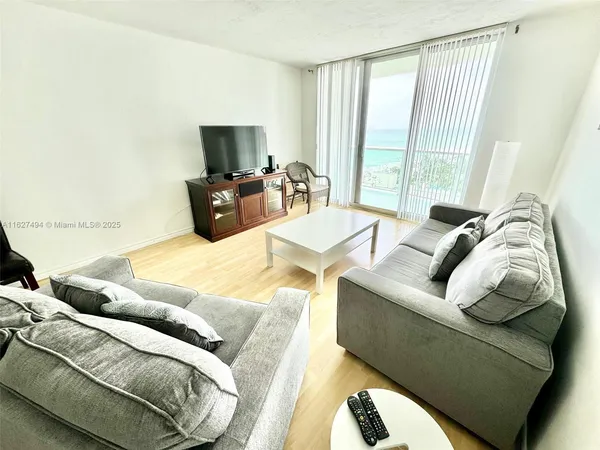 a bedroom with a bed and a television