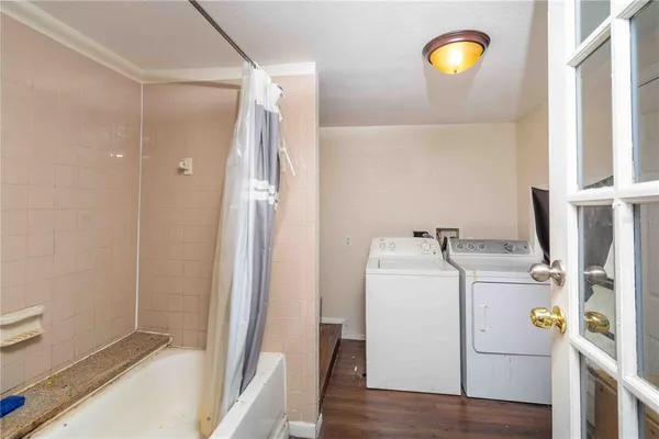 a view of storage and utility room with a washer and dryer
