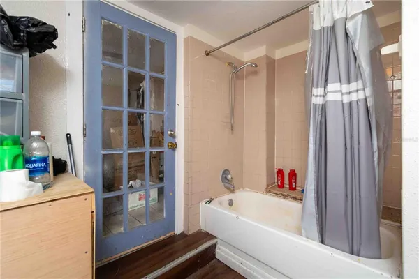 a bathroom with a bathtub and a shower