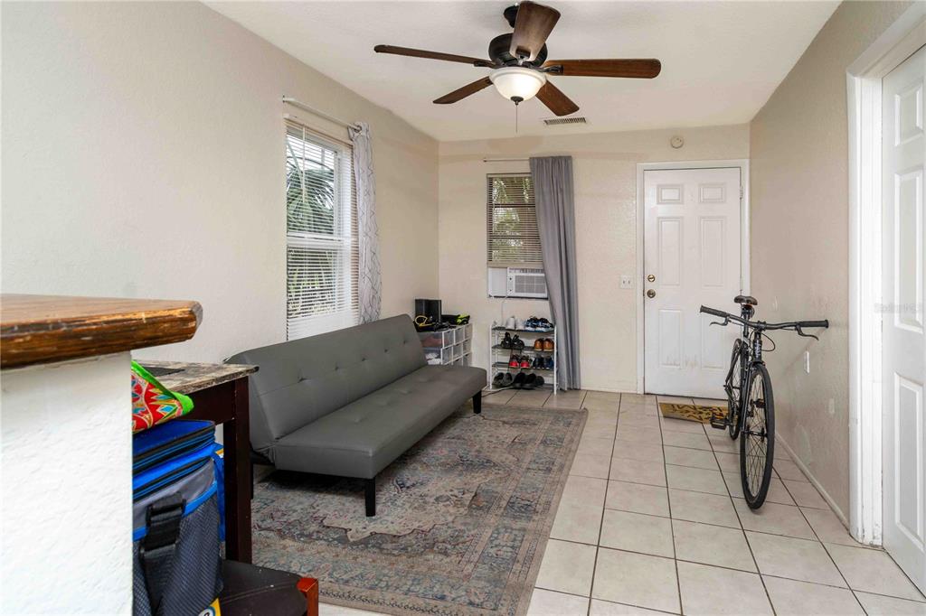 1142 7th Street Northwest Largo, FL 33770 - Photo 5 of 26 a living room with furniture and a window