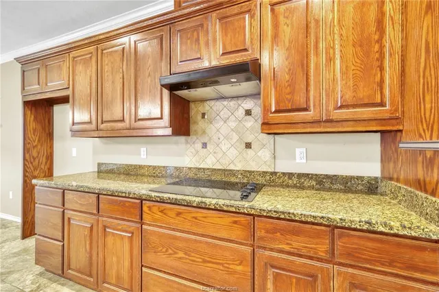 a spacious bathroom with a tub sink and mirror