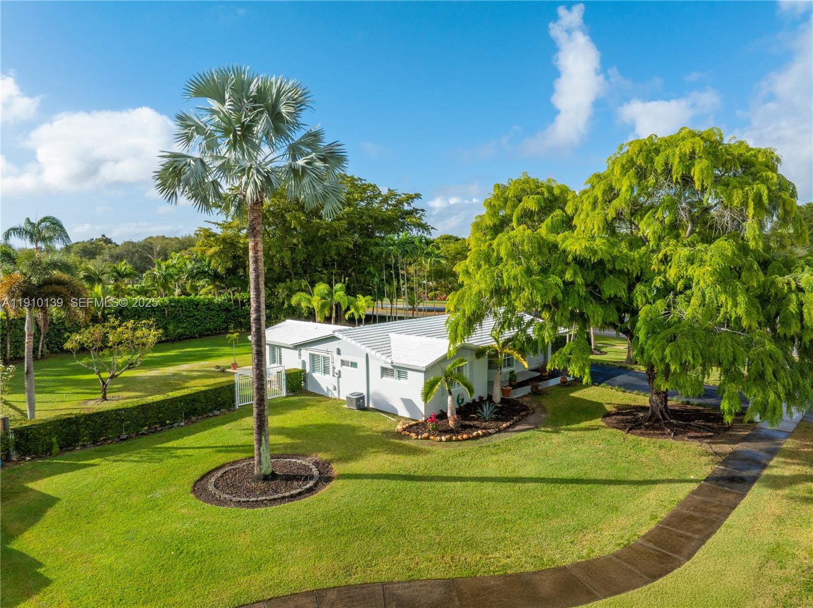 10320 Southwest 91st Street Miami, FL 33176 - Photo 1 of 30 a view of a garden with a slide