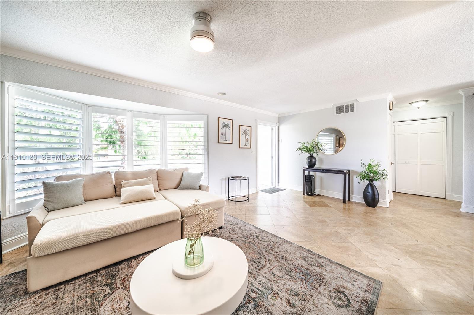 10320 Southwest 91st Street Miami, FL 33176 - Photo 15 of 30 a living room with furniture and a large window