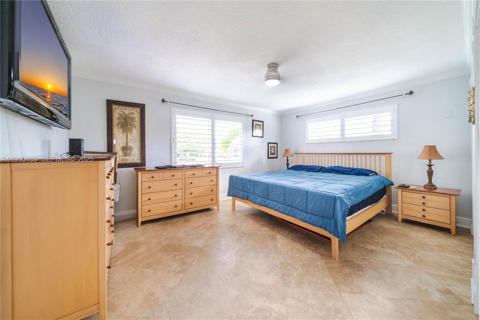 10320 Southwest 91st Street Miami, FL 33176 - Photo 17 of 30 a bedroom with a bed and a night stand