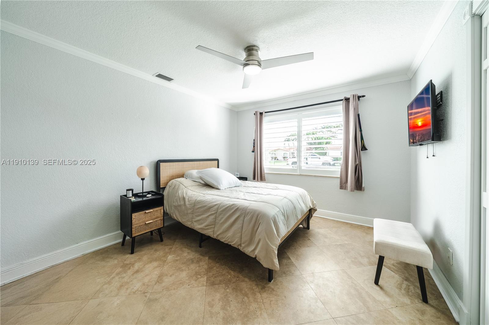 10320 Southwest 91st Street Miami, FL 33176 - Photo 20 of 30 a bedroom with a bed and a chair